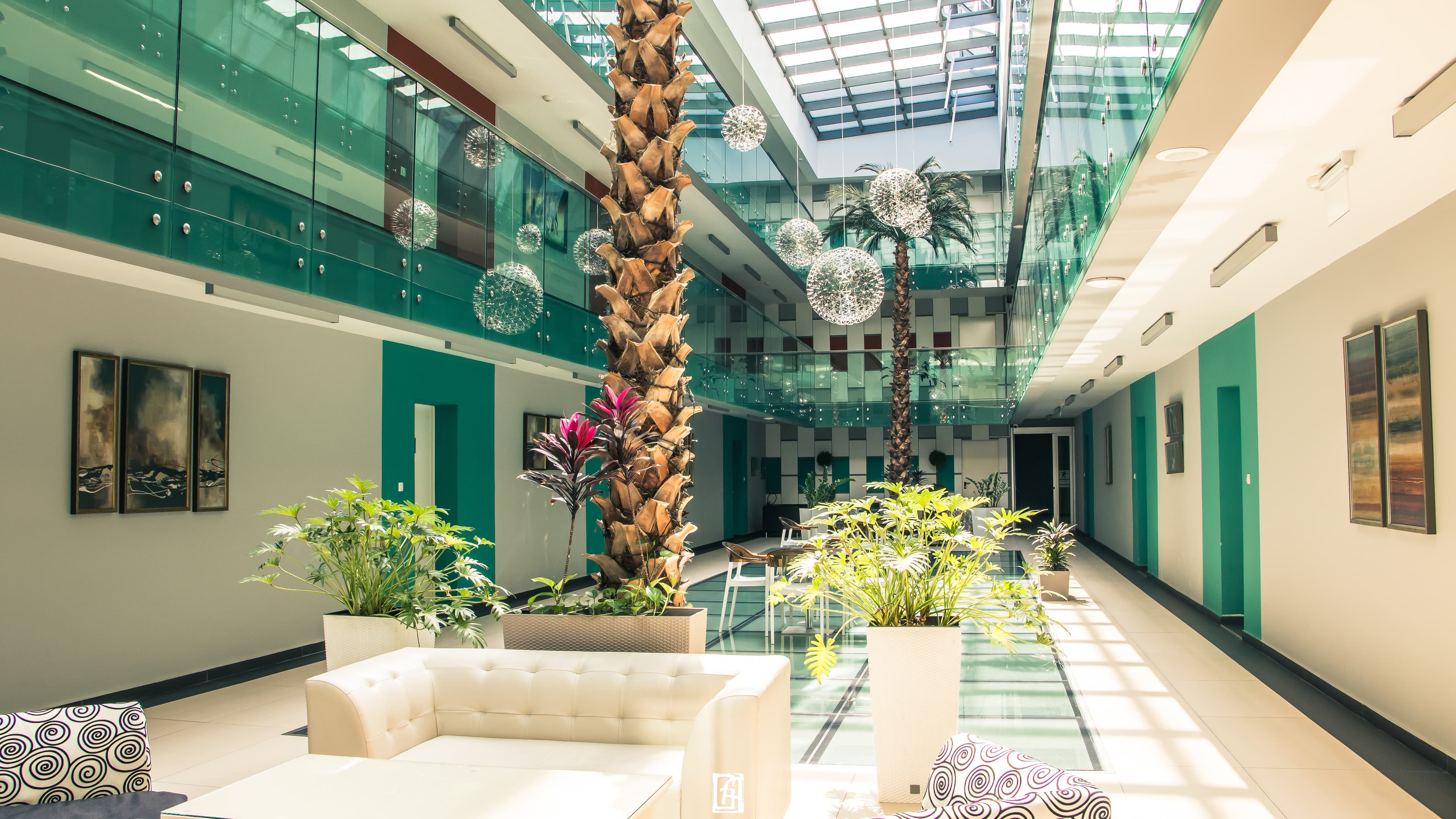 Sunlit interior atrium at Capitol Suites and Residence