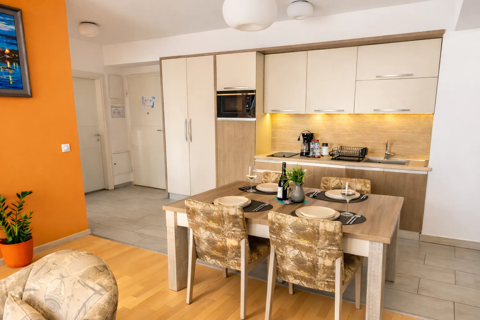 Kitchen with dining table, one-bedroom suite at Capitol Suites, Skopje