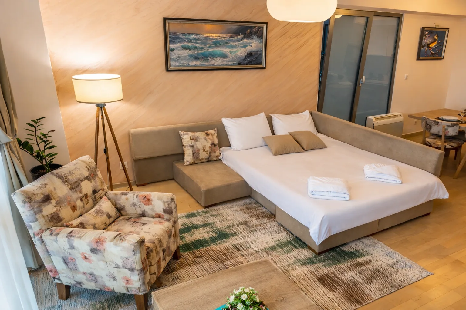 Living room with sofa and armchair, one-bedroom suite at Capitol Suites, Skopje