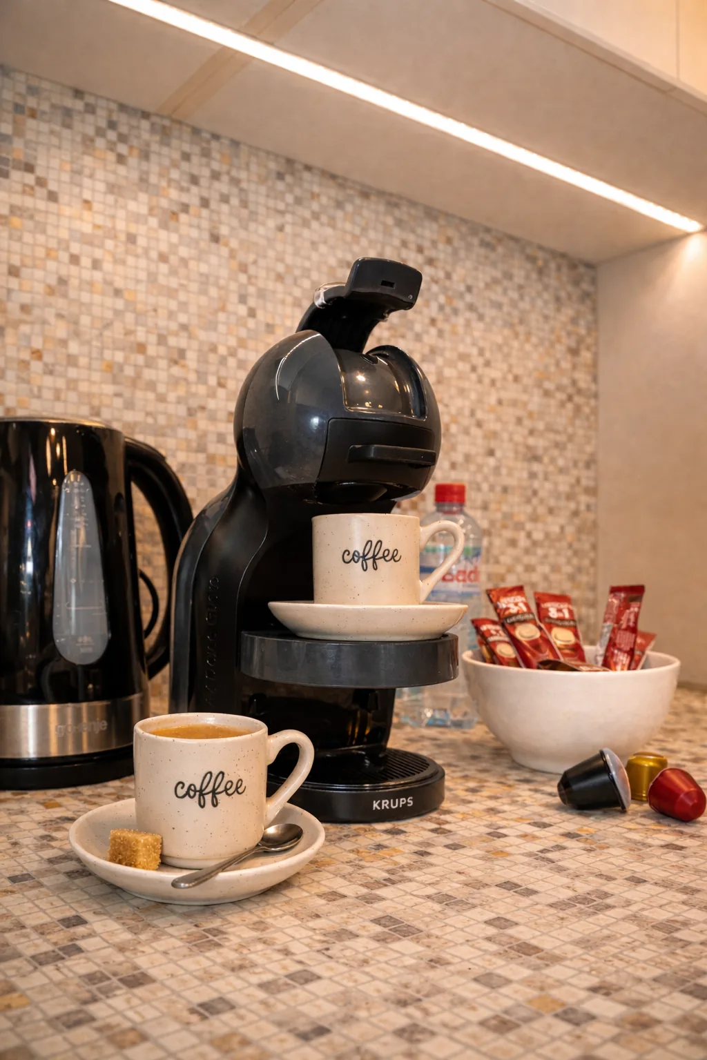 Coffee machine, kettle and complimentary coffee in the kitchen, one-bedroom suite at Capitol Suites, Skopje