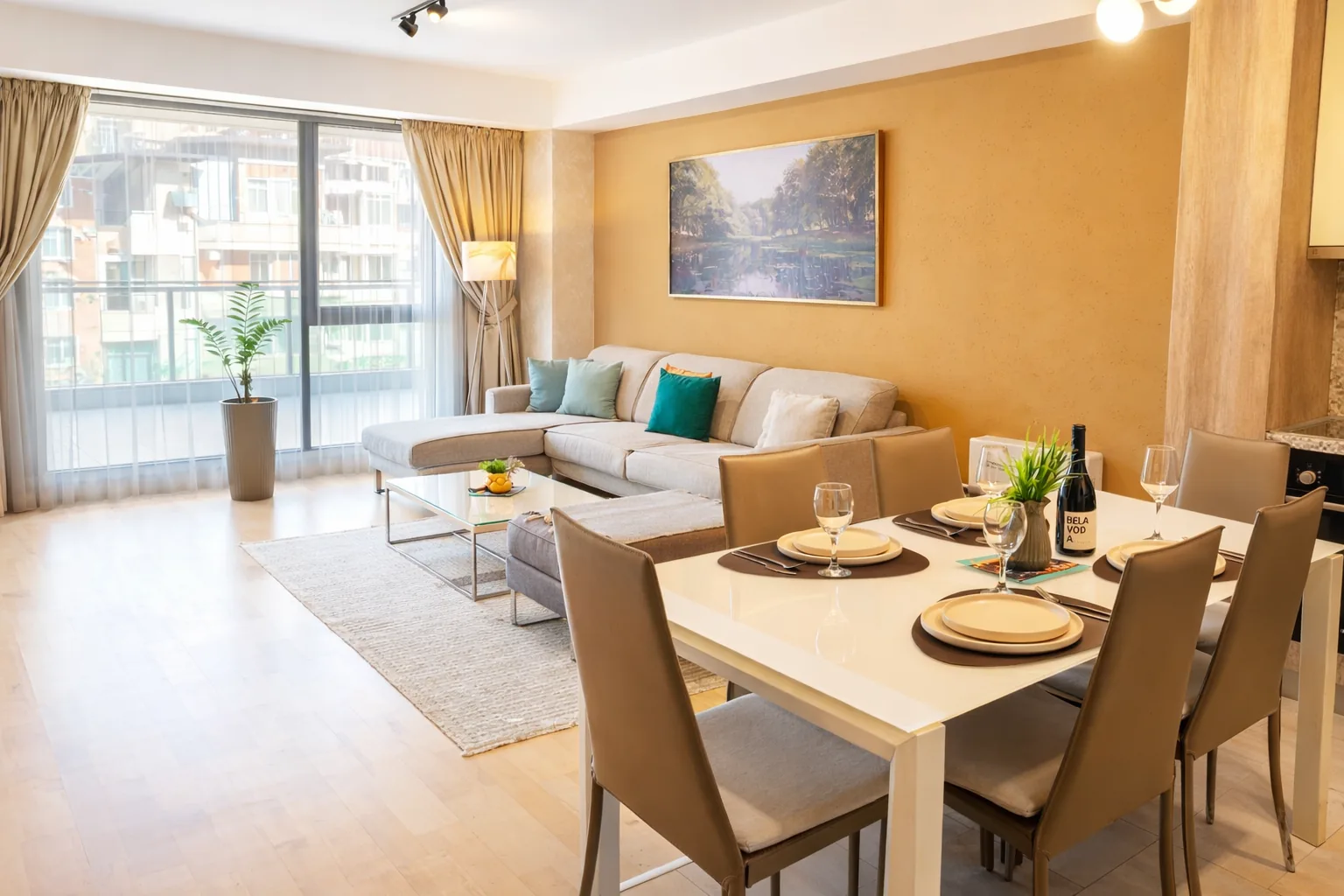 Living area with corner sofa, dining table and terrace windows, one-bedroom suite at Capitol Suites, Skopje
